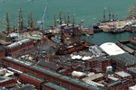 Aerial view of Portsmouth Dockyard, showing HMS Victory and a flotilla of tall ships. Taking part in the International Fleet Review which was part of the Trafalgar 200 celebrations. (© UK Government, OGL v1.0)
