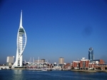 Gunwharf Quays with Spinnaker Tower (left) viewed from the water (© Editor5807, CC BY 3.0)